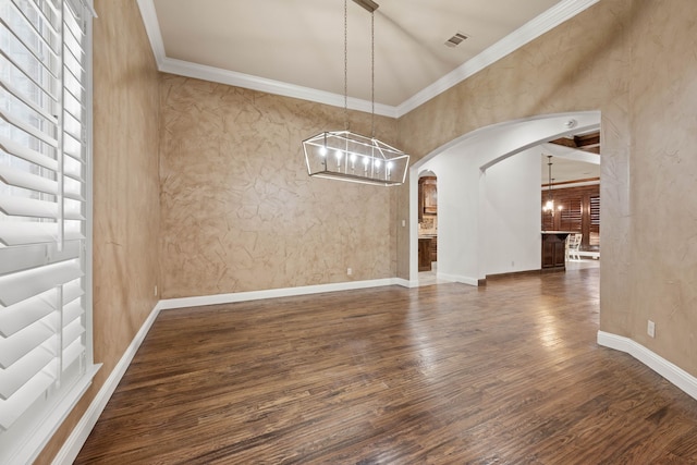 unfurnished dining area with crown molding, dark wood-type flooring, and an inviting chandelier