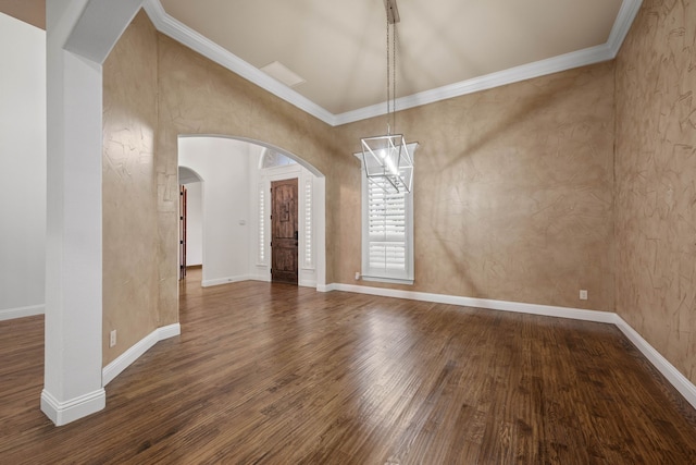 unfurnished dining area featuring dark hardwood / wood-style flooring, vaulted ceiling, and ornamental molding