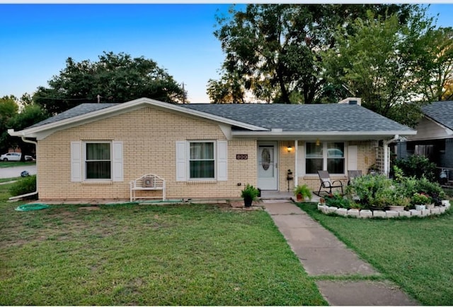 ranch-style house with a front lawn