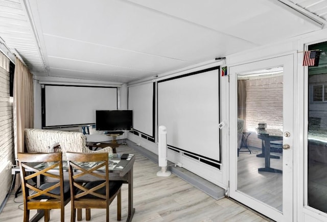 home theater room with light wood-type flooring