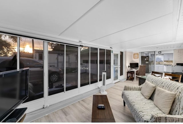 living room featuring expansive windows and light wood-type flooring