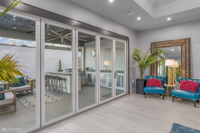 doorway to outside featuring light hardwood / wood-style floors and french doors