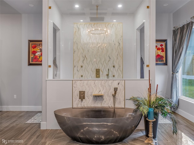 bathroom with hardwood / wood-style flooring and walk in shower