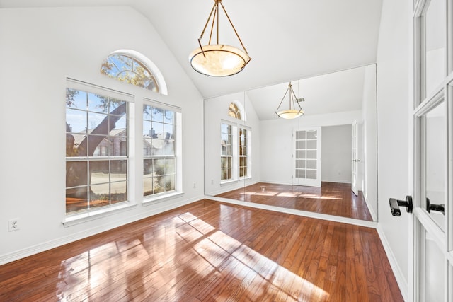 interior space featuring french doors, lofted ceiling, and hardwood / wood-style flooring