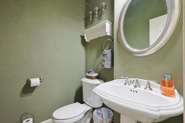 bathroom with toilet and sink