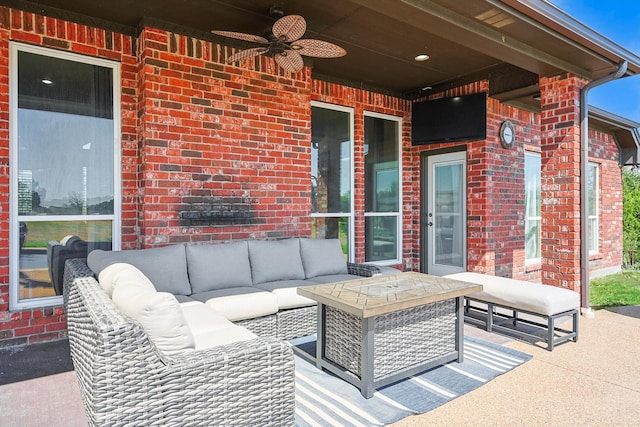 view of patio with an outdoor living space and ceiling fan