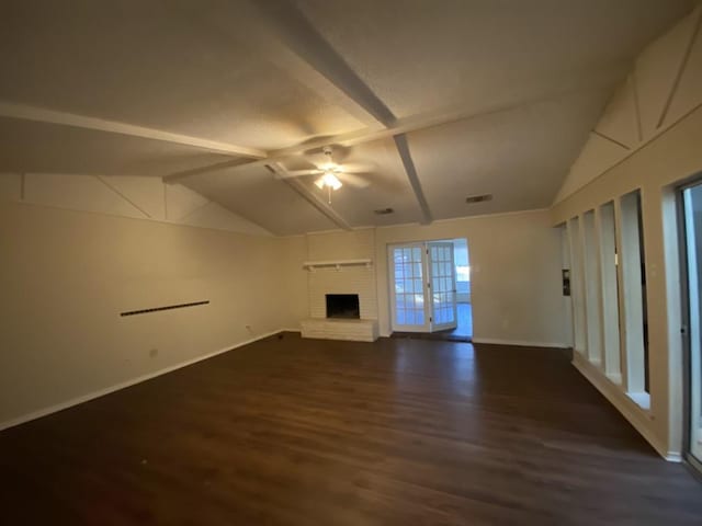 unfurnished living room featuring a fireplace, vaulted ceiling with beams, ceiling fan, and dark wood-type flooring