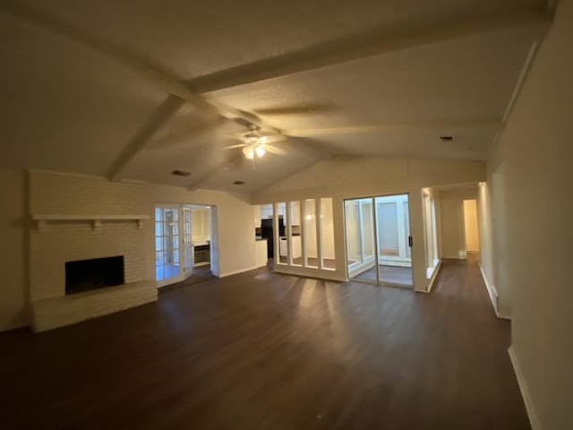 unfurnished living room featuring ceiling fan, lofted ceiling with beams, dark hardwood / wood-style flooring, and a brick fireplace