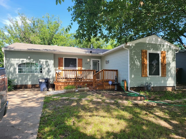 view of front of house featuring a wooden deck