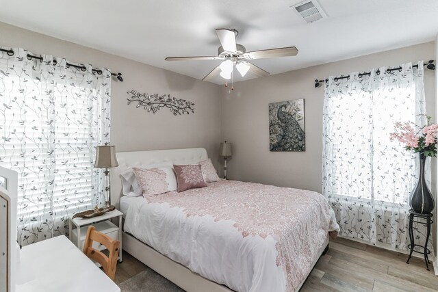 bedroom featuring hardwood / wood-style floors and ceiling fan