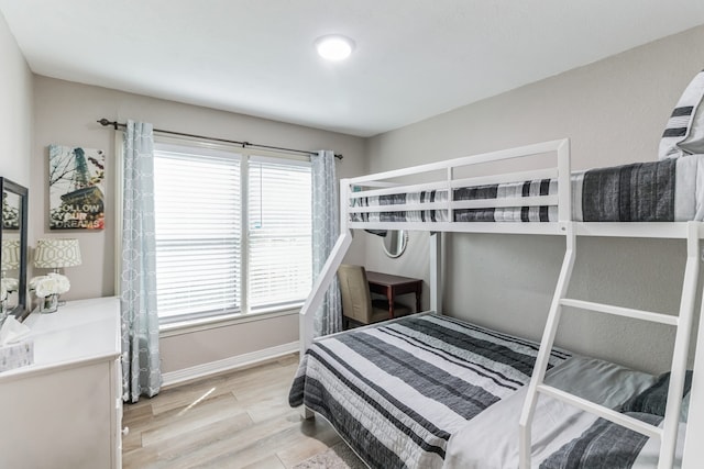 bedroom with light hardwood / wood-style floors