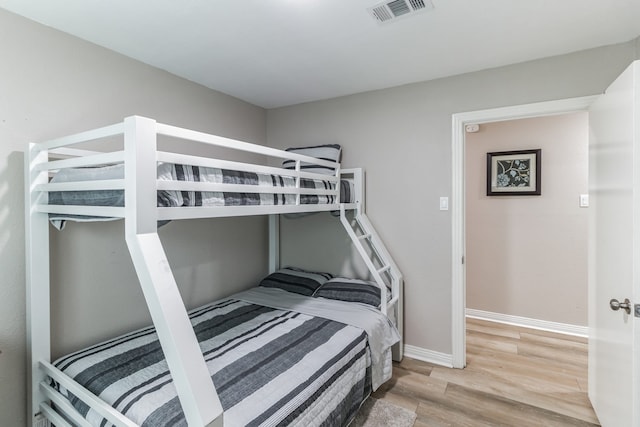 bedroom featuring wood-type flooring