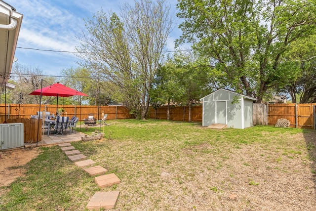 view of yard featuring central AC unit, a patio area, and a shed