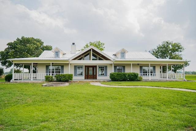 country-style home with covered porch and a front yard