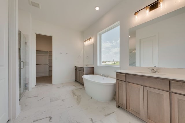 bathroom with plus walk in shower and vanity