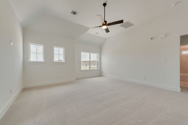 carpeted empty room featuring ceiling fan and high vaulted ceiling