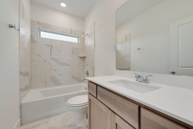 full bathroom featuring vanity, toilet, and tiled shower / bath