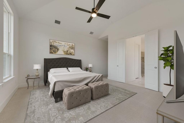 carpeted bedroom featuring ceiling fan and lofted ceiling