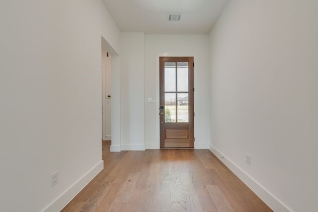 doorway with light hardwood / wood-style floors