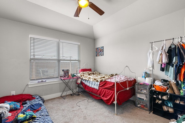 carpeted bedroom featuring lofted ceiling and ceiling fan