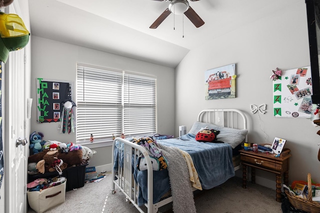 bedroom with vaulted ceiling, carpet floors, and ceiling fan