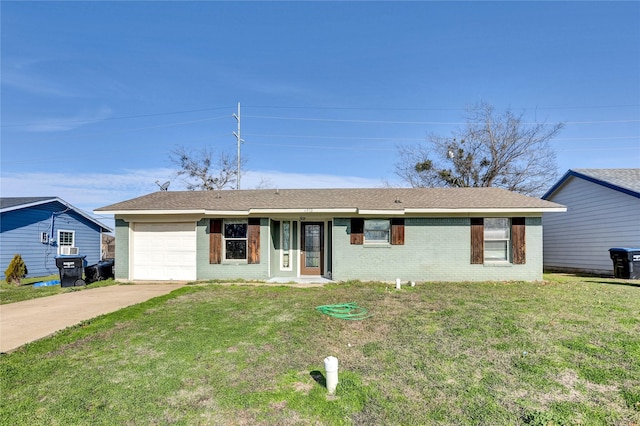 ranch-style house featuring a garage and a front yard