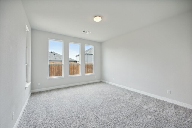 empty room with light colored carpet