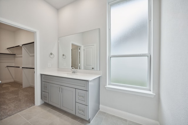 bathroom with tile patterned flooring and vanity