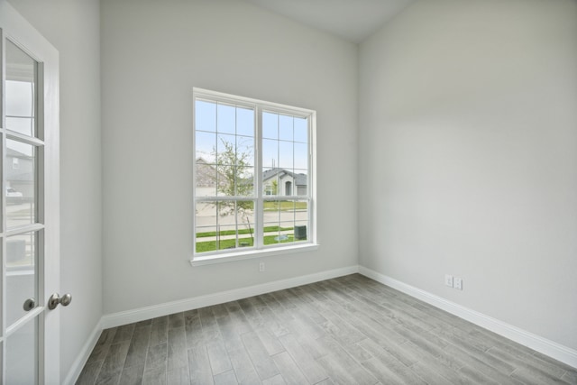 spare room featuring light wood-type flooring