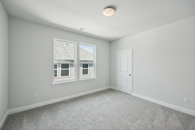 unfurnished room with carpet floors