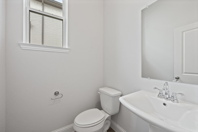 bathroom featuring toilet and sink