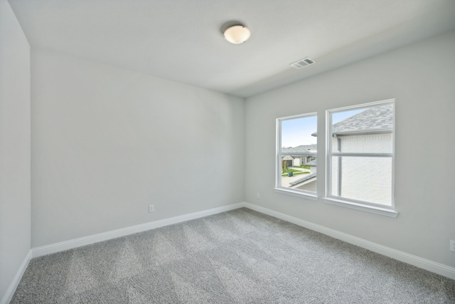 unfurnished room featuring carpet floors