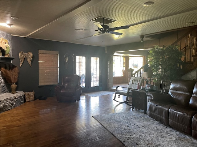 living area featuring wood finished floors and ceiling fan