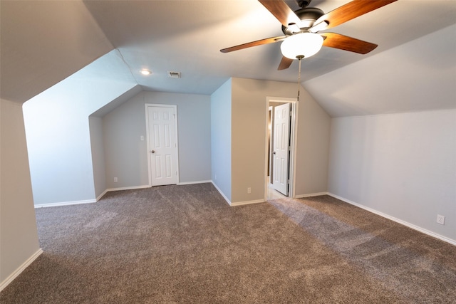 bonus room featuring carpet, lofted ceiling, baseboards, and visible vents