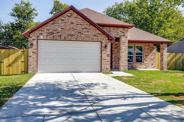 front of property with a garage and a front lawn