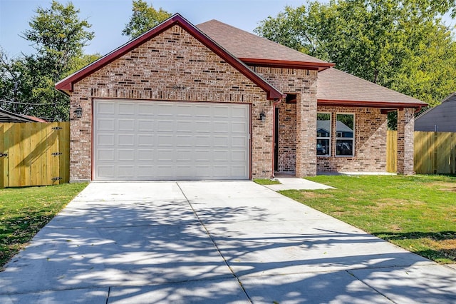 front of property featuring a garage and a front yard