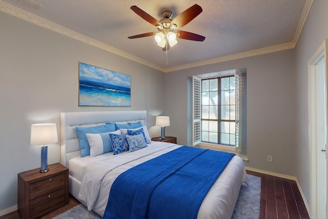 bedroom featuring ceiling fan, dark hardwood / wood-style floors, and crown molding