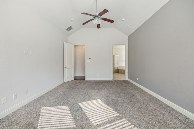 unfurnished bedroom with ceiling fan, connected bathroom, light carpet, and high vaulted ceiling