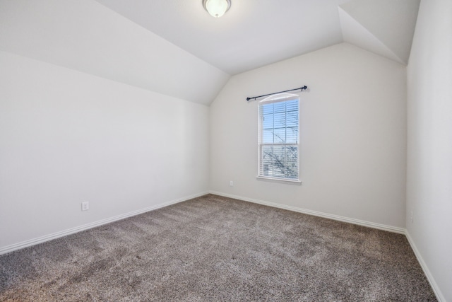 bonus room featuring lofted ceiling and carpet floors