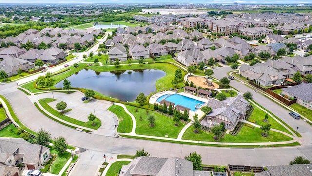 birds eye view of property with a water view