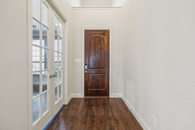 entryway with dark wood-type flooring and french doors