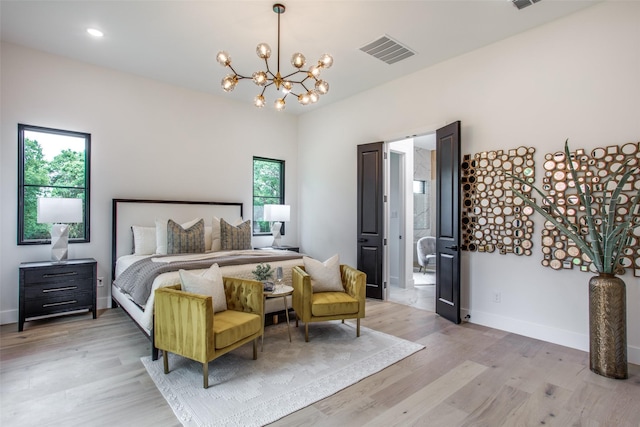 bedroom featuring light wood-style flooring, a notable chandelier, baseboards, and visible vents