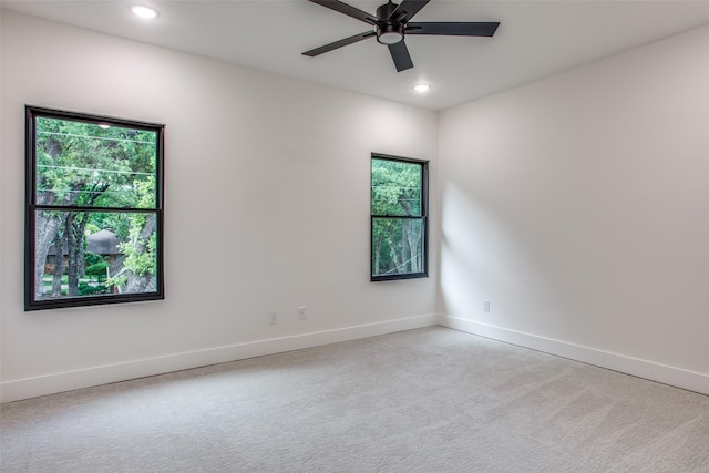 spare room with carpet flooring, recessed lighting, baseboards, and ceiling fan