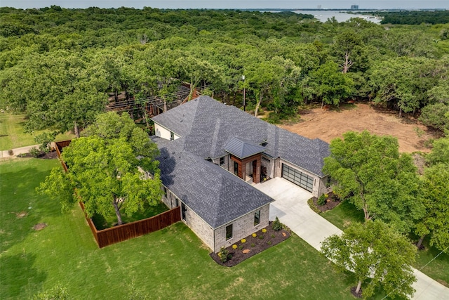 aerial view featuring a wooded view