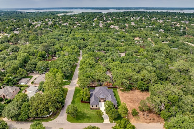 bird's eye view featuring a wooded view