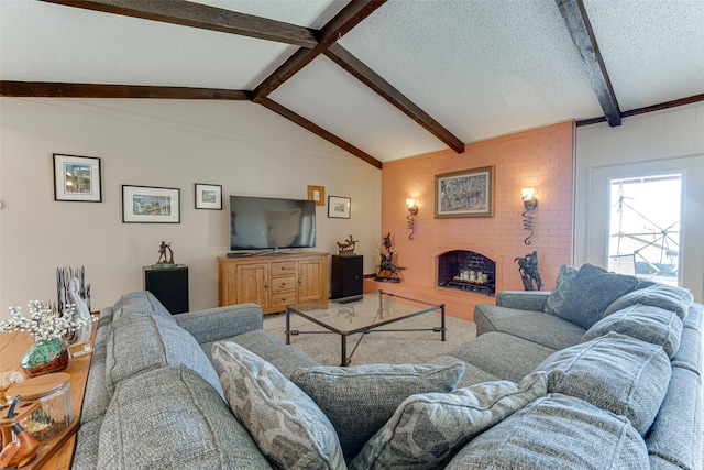 living room with vaulted ceiling with beams, hardwood / wood-style flooring, a fireplace, and a textured ceiling