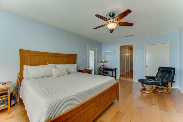 bedroom featuring ornamental molding, light hardwood / wood-style floors, and ceiling fan