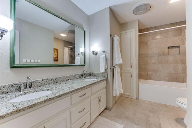 full bathroom with vanity, shower / bath combo, tile patterned floors, and toilet