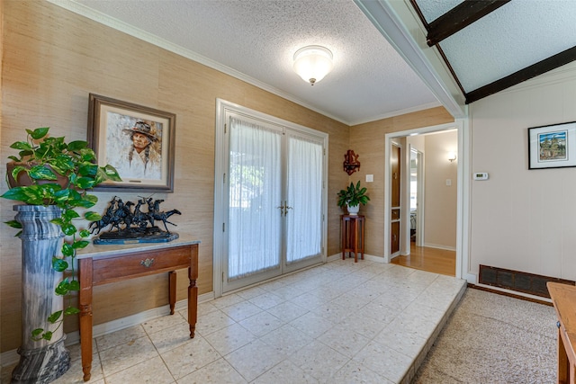 foyer featuring crown molding, beam ceiling, french doors, and a textured ceiling