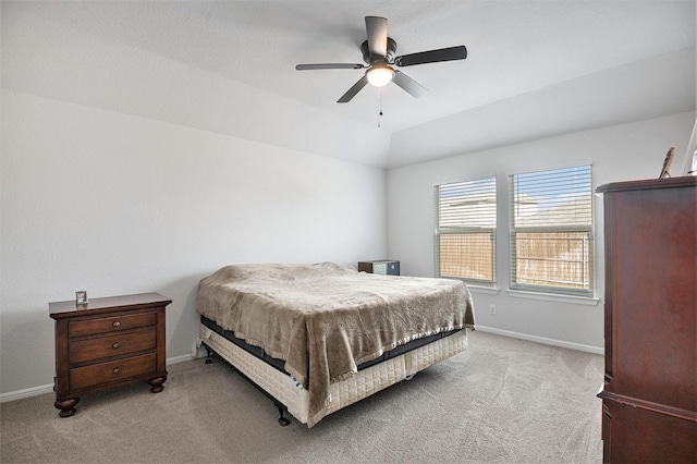 carpeted bedroom with ceiling fan and lofted ceiling